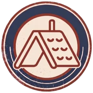 A circular badge with a stylized line drawing of a pitched tent in the center, surrounded by red and blue rings, and a weathered, vintage appearance.